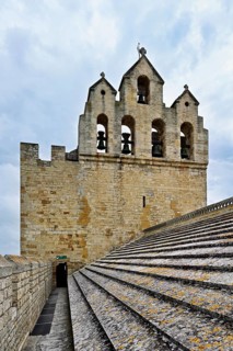Bell tower of the Notre-Dame-de-la-Mer Roman Catholic Church, Saintes-Maries-de-la-Mer, Camargue,