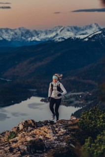 Trail running in autumn on the Jochberg on Lake Walchensee against the wonderful backdrop of the