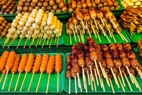 BBQ skewers with Thai specialties at a stand below the Wat Phra That Doi Suthep temple complex,