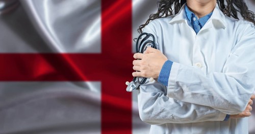 Healthcare professional with England flag background. Professional doctor holding stethoscope on