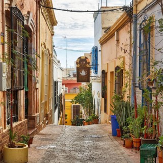 Picturesque alleyway Calle de la Almedina, charming, traffic-calmed Arab quarter with colorful