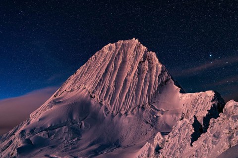 Alpamayo southwest face with glacier in evening light and starry sky, 5947 m, with the title of