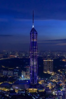 Merdeka 118, Merdeka Tower, neo-futuristic megatall skyscraper illuminated at dusk in capital city