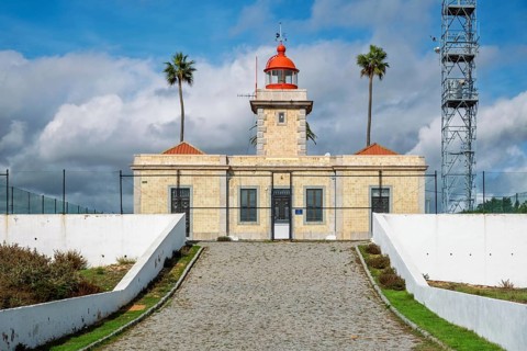 View of the Ponta da Piedade Lighthouse on the coastal cliffs in Lagos, Algarve region of Portugal.