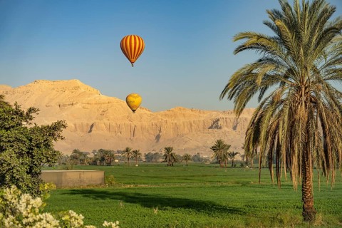 Hot air balloons with tourists over ancient Thebes near Luxor, Egypt
