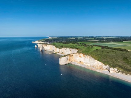 Aerial view of the spectacular chalk coast near Étretat with the distinctive rock formations of La