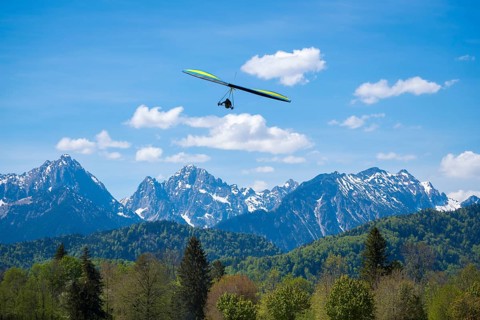A hang glider hovers over an impressive mountain landscape, Schwangau, Ostallgäu, Alps, Allgäu,