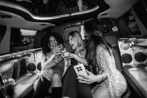Young diverse women celebrating a special occasion, drinking champagne, and enjoying a fun night
