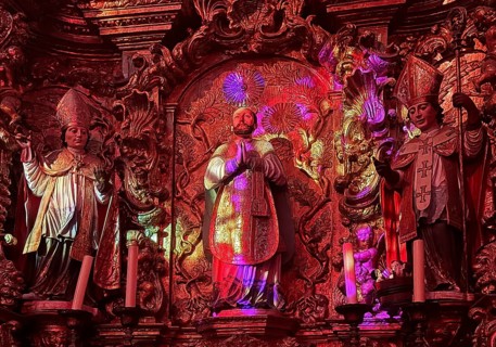 Colourful religious art, light show in a church, Porto, Portugal