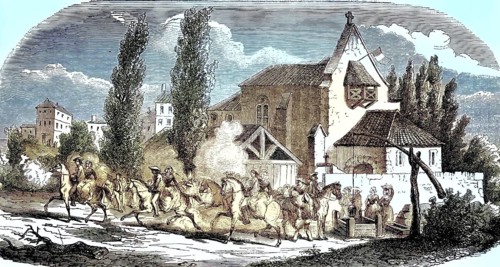 A rural, historic village scene in France in front of a church and a fortified well house, in the