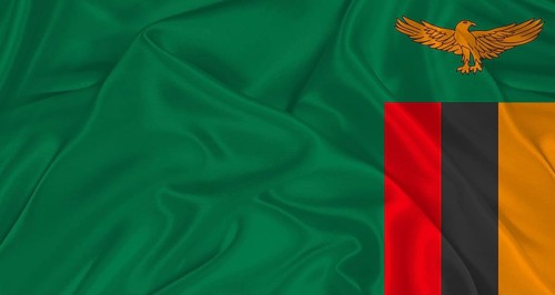 Zambian flag with fabric texture. Realistic flag of Zambia waving, National flag