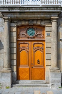 Entrance portal, wooden door to a town house in the historic old town of Saint Malo,
