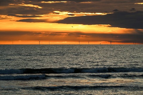 Large wind turbines, wind turbines at sunset at sea, surf, Houvig Beach, Denmark