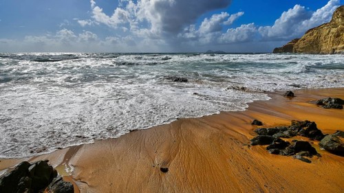 Red Beach, a dream beach in the neighboring bay of Matala, wild waves meet a sandy beach with rocks