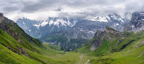 View of a green high valley and steep mountain peaks, cloud-covered mountain landscape, Rote Härd,