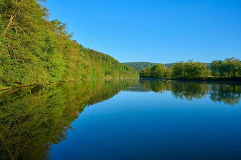 Landscape with reflection river and lush green shore, Boxtal, Main-Boxtal, Tauber district,