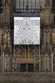 Scaffolding with black and white depiction of the restoration work on the north façade, Cologne,