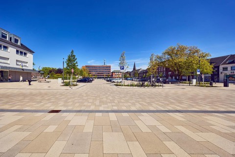Parking lot with cars, general architecture, residential and commercial buildings, town hall, total