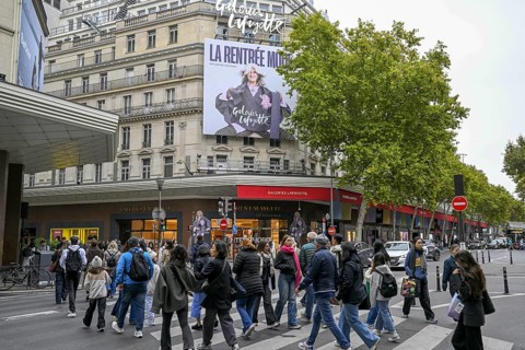 Passers-by in front of Galeries Lafayette, France's most famous department store, Boulevard