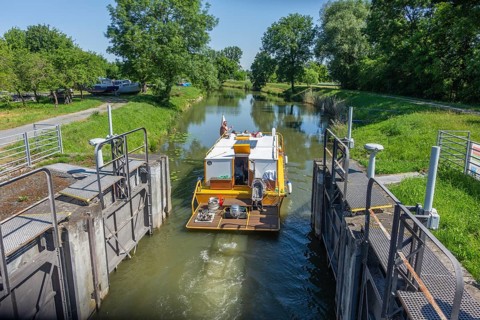 Houseboat passes through Batuv Canal lock, Strážnice, Jihomoravský kraj, Czech Republic