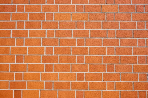 Orange brick wall with checkerboard pattern, Bavaria, Germany