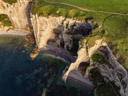 Aerial view of rugged chalk cliffs in the evening sun, Falaise d'Amont, Étretat, Alabaster Coast,