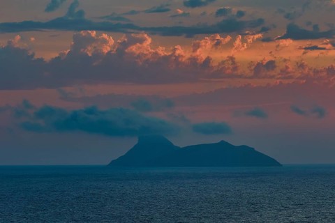 Paximadia island, island surrounded by clouds, dusk at sea, Matala, South Coast, Crete, Greek