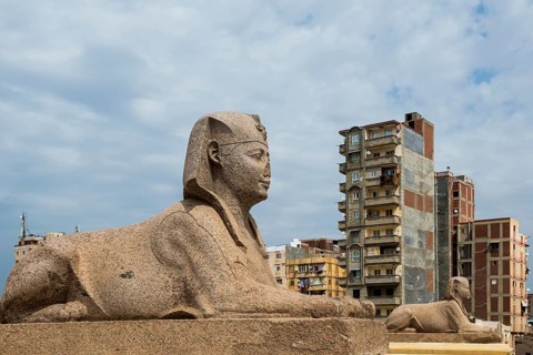 Roman archaeological site in the middle of the city and skyscrapers, Pompey's Column, Alexandria,