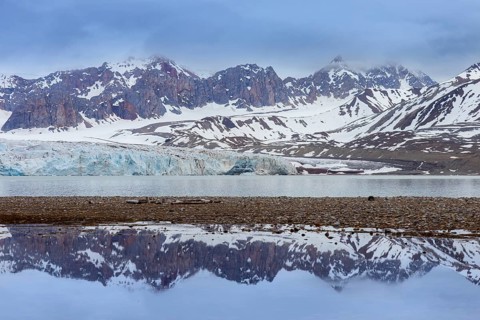 Fjortende Julibreen, 14th of July Glacier calving into Krossfjorden in spring, Haakon VII Land,