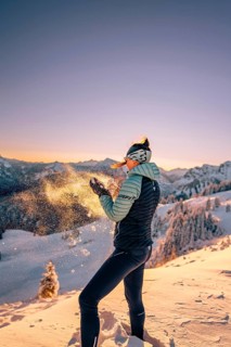 Summit bliss in the snow-covered winter landscape in the Tannheimer Tal in the Alps on the