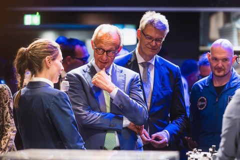 Friedrich Merz, Patrick Schnieder and Alexander Gerst during the Chancellor's tour of the ILA