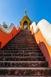 Steep stairs lead up to the Buddhist temple Wat Phra That Don Phra Chan, near Lampang, Lampang