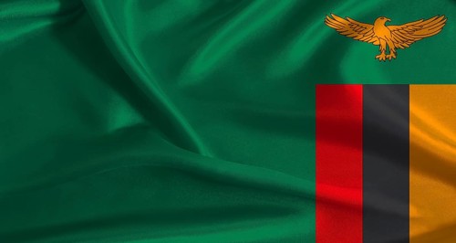 Zambia flag with cloth textured background. National flag of Zambia with realistic texture