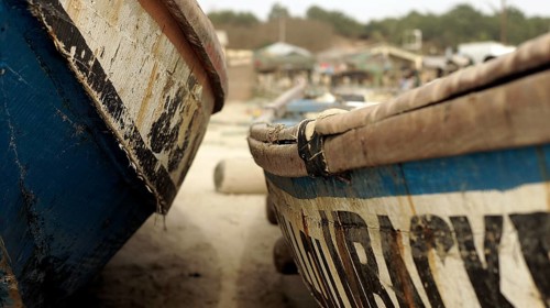 Close-up, Two traditional wooden boats side by side in the sand of a fishing village, Cap Skirring,