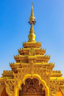Gilded Chedi temple tower, stupa, in the Wat Phra That Don Phra Chan Buddhist temple, near Lampang,