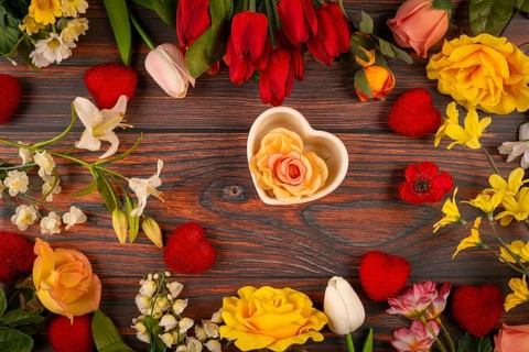 Flowers and hearts on wood