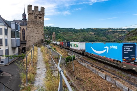 Freight train, in the Upper Middle Rhine Valley, runs directly in front of the residential