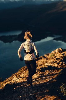 Trail running in autumn on the Jochberg on Lake Walchensee against the wonderful backdrop of the