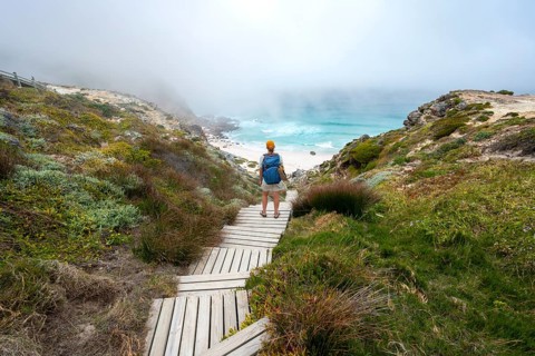 Young tourist on Diaz Beach, sandy beach at the Cape of Good Hope, Eastern Cape, South Africa