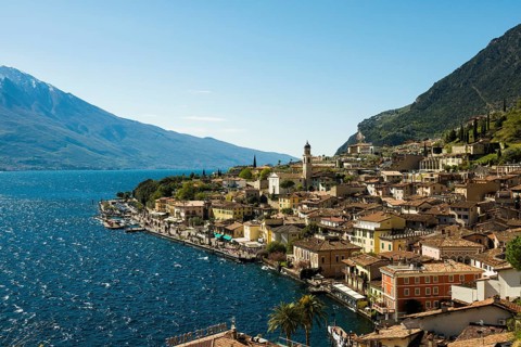 Picturesque village and colorful houses on the lake and steep mountains, Limone sul Garda, Lake