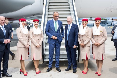 Friedrich Merz (Chancellor of the Federal Republic of Germany, CDU) flanked by flight attendants