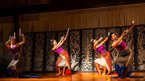 Young Thai women in traditional dress showing a traditional dance, Old Chiang Mai Cultural Center,