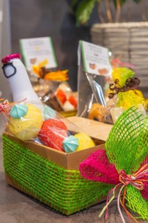 A colorful gift basket with chocolates, lovingly decorated and packaged, conveys a cheerful and