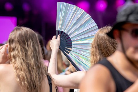 Festival visitors with large fans at the Lollapalooza Festival on the Olympic Site, Berlin, 18.07