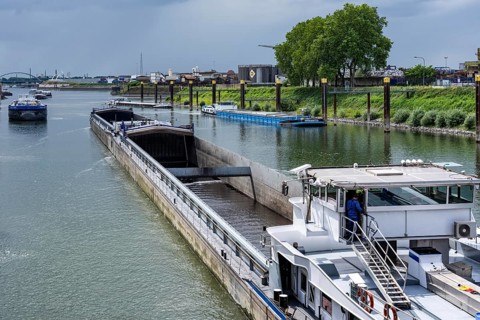 Freight ships in the port canal in the port of Duisburg-Ruhrort are waiting in front of the