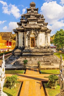 Stone temple shrine in the Wat Phra Singh Buddhist temple complex, Chiang Mai Old City Center,