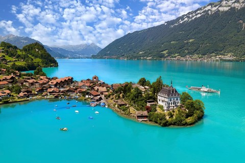 View of Iseltwald from above, peninsula in Lake Brienz with steamboat, Canton of Bern, Switzerland