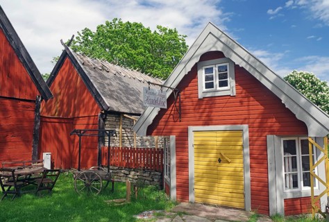 Traditional red houses in an idyllic rural setting under blue skies, museum, Himmelsberga, Öland,