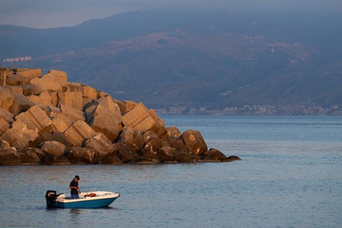 Fishing fisherman, Scilla, Strait of Messina, Sicily in the background, Calabria, Italy