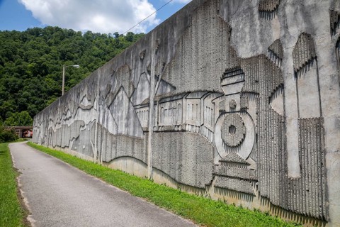 Matewan, West Virginia, The flood wall along the Tug Fork River highlights the coal mining and
